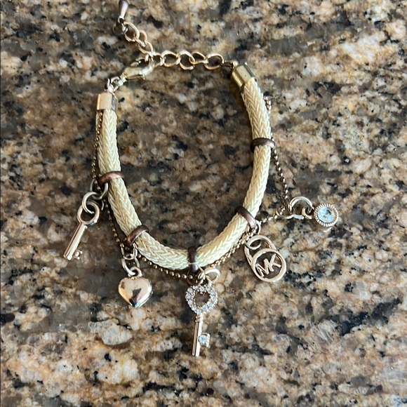 Michael Kors Jewelry - Michael Kors Gold Charm Bracelet with Elegant Design